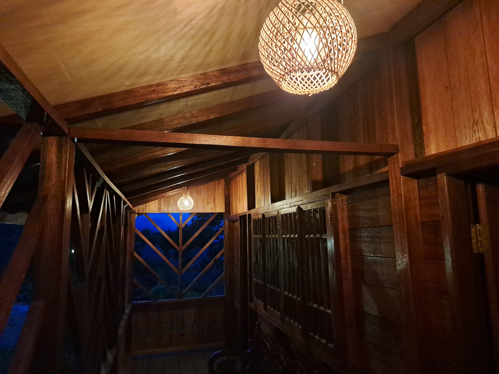 Classic wooden ecolodge accommodation at night